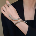 Snake-inspired ring and bracelet set with exaggerated twisted winding design in electroplated metal