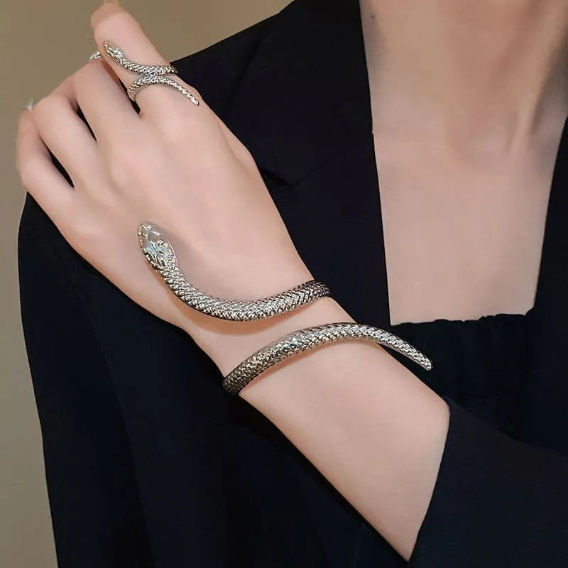 Snake-inspired ring and bracelet set with exaggerated twisted winding design in electroplated metal