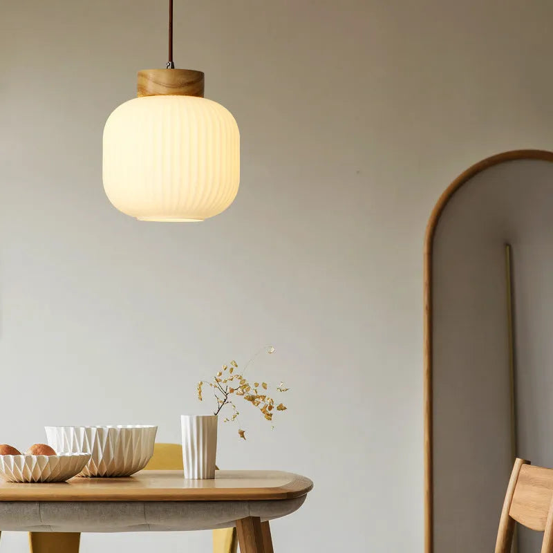 Nordic style wooden pendant ceiling light with solid wood retro design in a bedroom setting.
