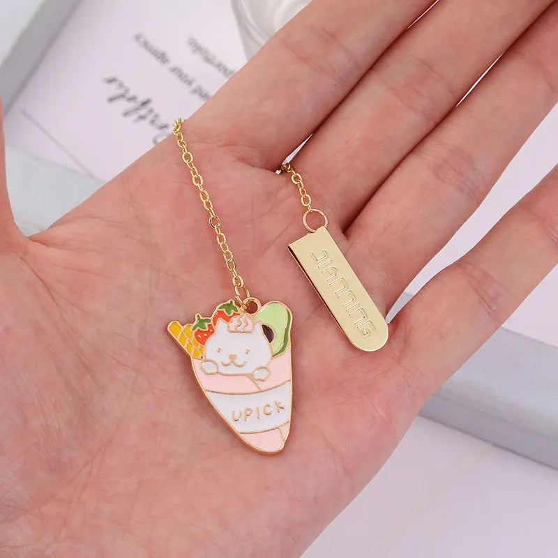 Jane Lime metal cat bookmark with food-themed designs including Strawberry Cake Cat and Cherry Sleeping Cat