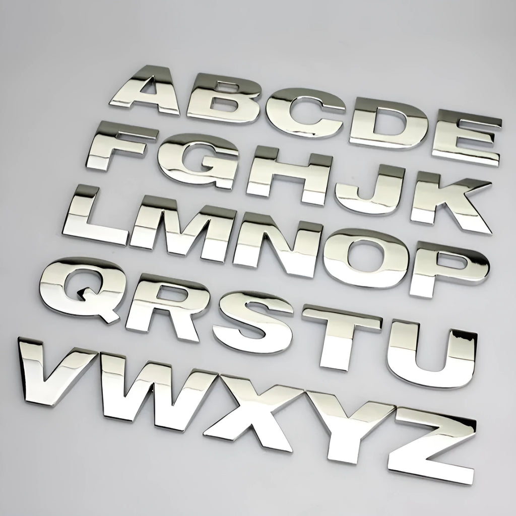 3D metal zinc alloy car bumper sticker showing a raised English letter on adhesive backing.