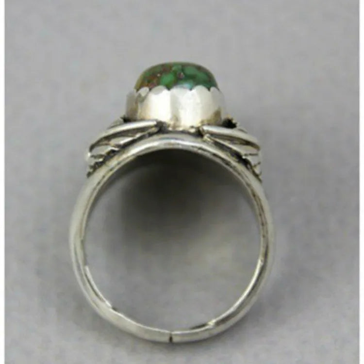 Women's turquoise geometric alloy ring with inlaid retro design, shown on a finger.