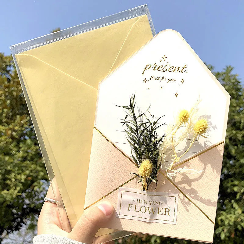Handmade 3D butterfly-shaped birthday card with artificial flowers and hot foil stamping details.