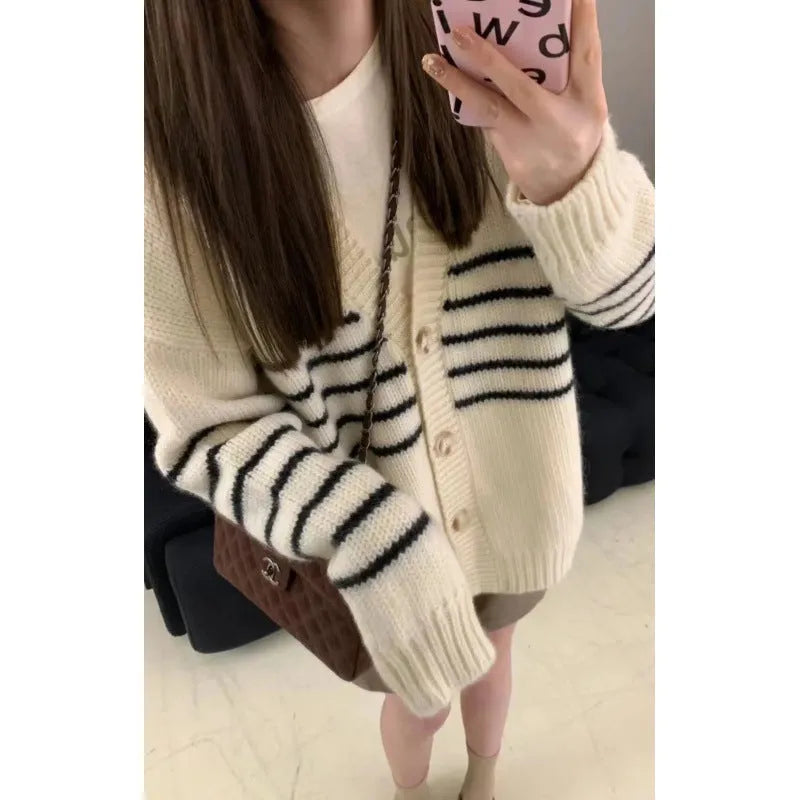 Women's button-down cardigan sweater with a 3D texture pattern in a casual style.
