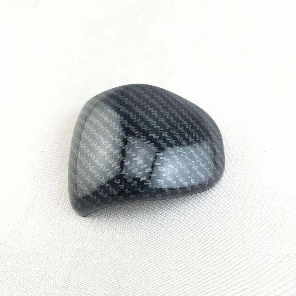 Black carbon fibre pattern gear shift head cover for Smart RunK3 car interior.