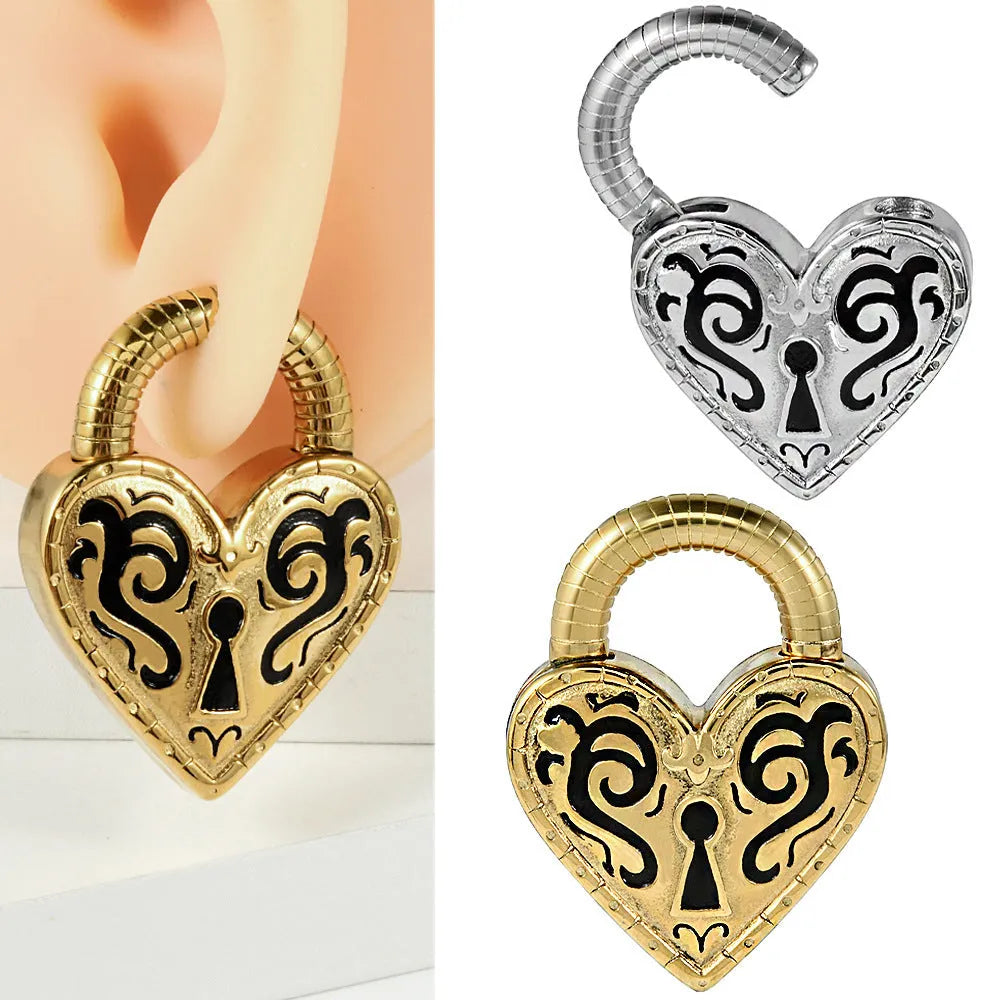 Close-up of a women's stainless steel heart-shaped earring for piercings, shown in gold and steel colour options.