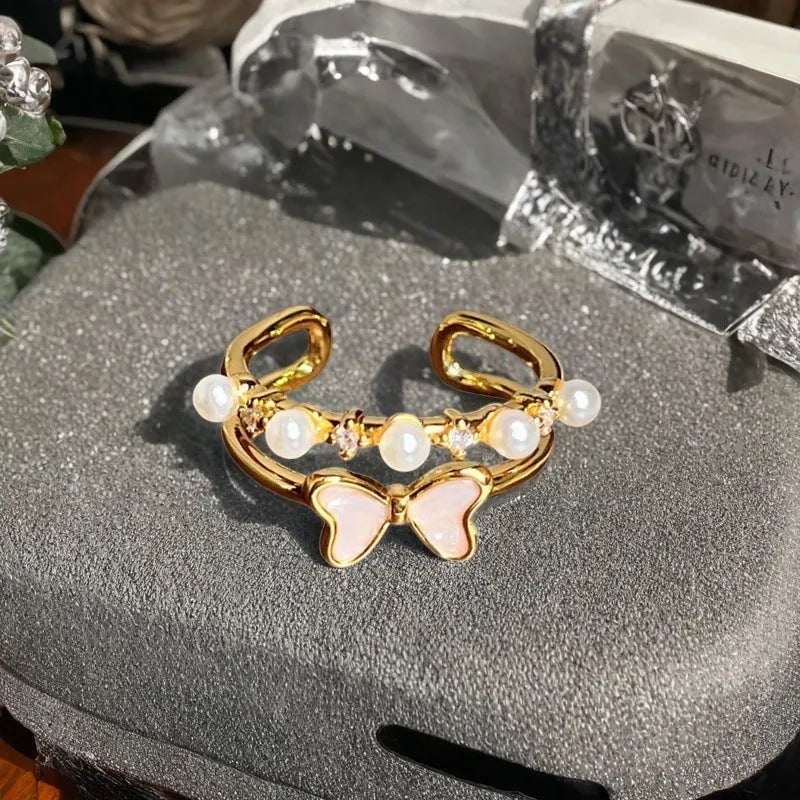 Adjustable vintage oil dripping finish copper ring with gourd motif and inlaid zircon stones.