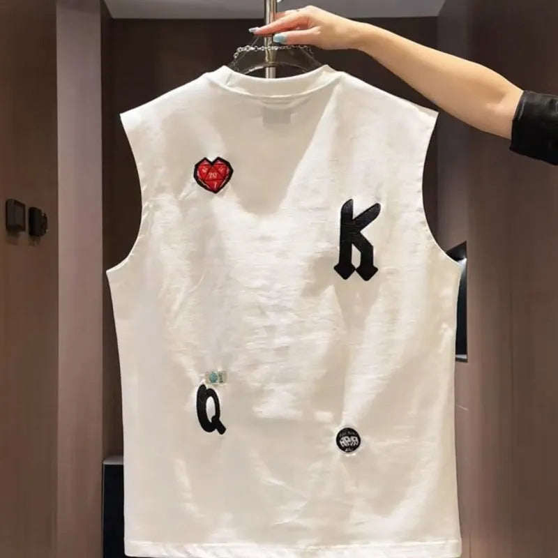 A man's white cotton sleeveless vest with a cartoon graphic print, shown in a loose fit.