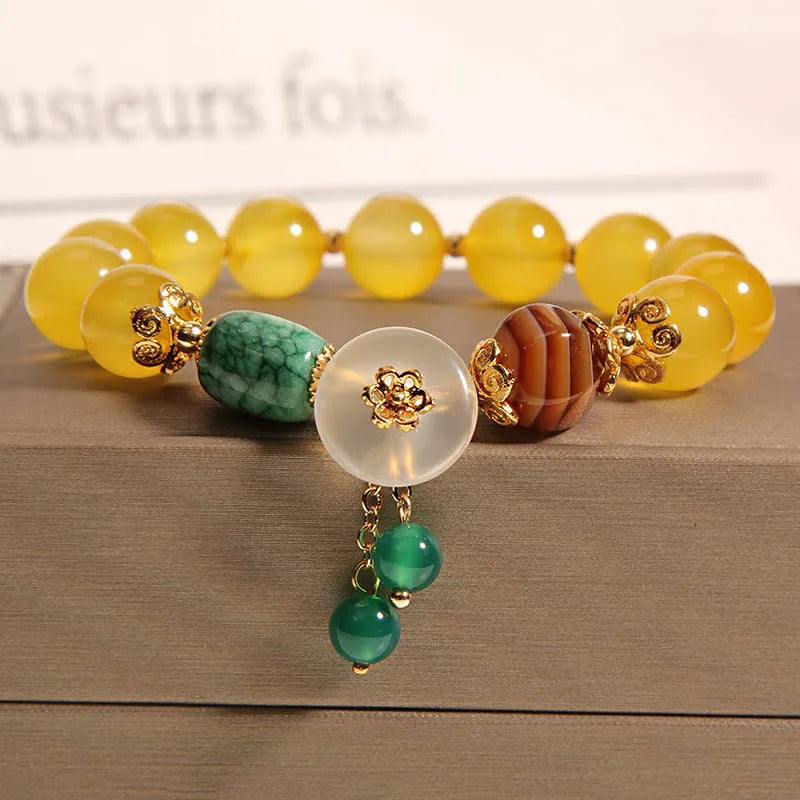 Yellow agate crystal women's bracelet with gold silk thread wrapping in khaki colour