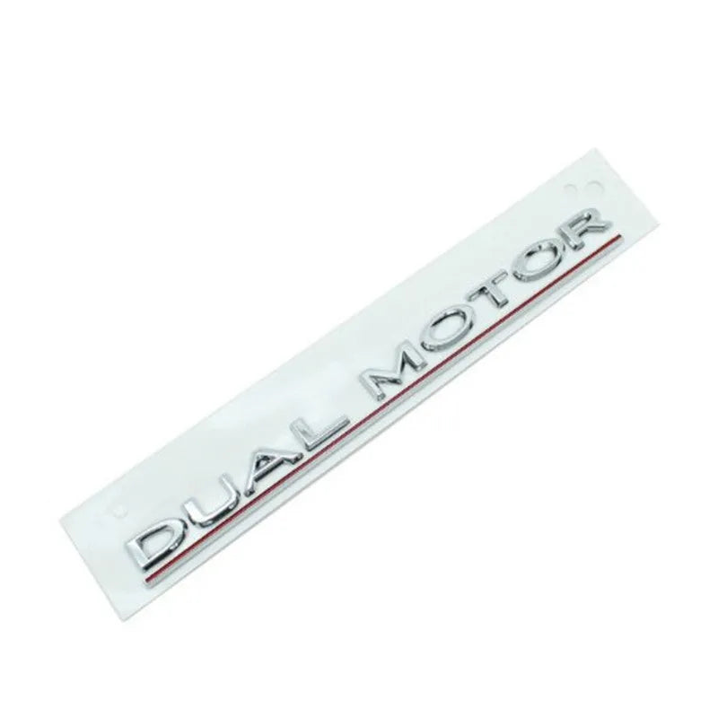 Tesla Model 3 dual motor performance sticker in black and red on a car bumper