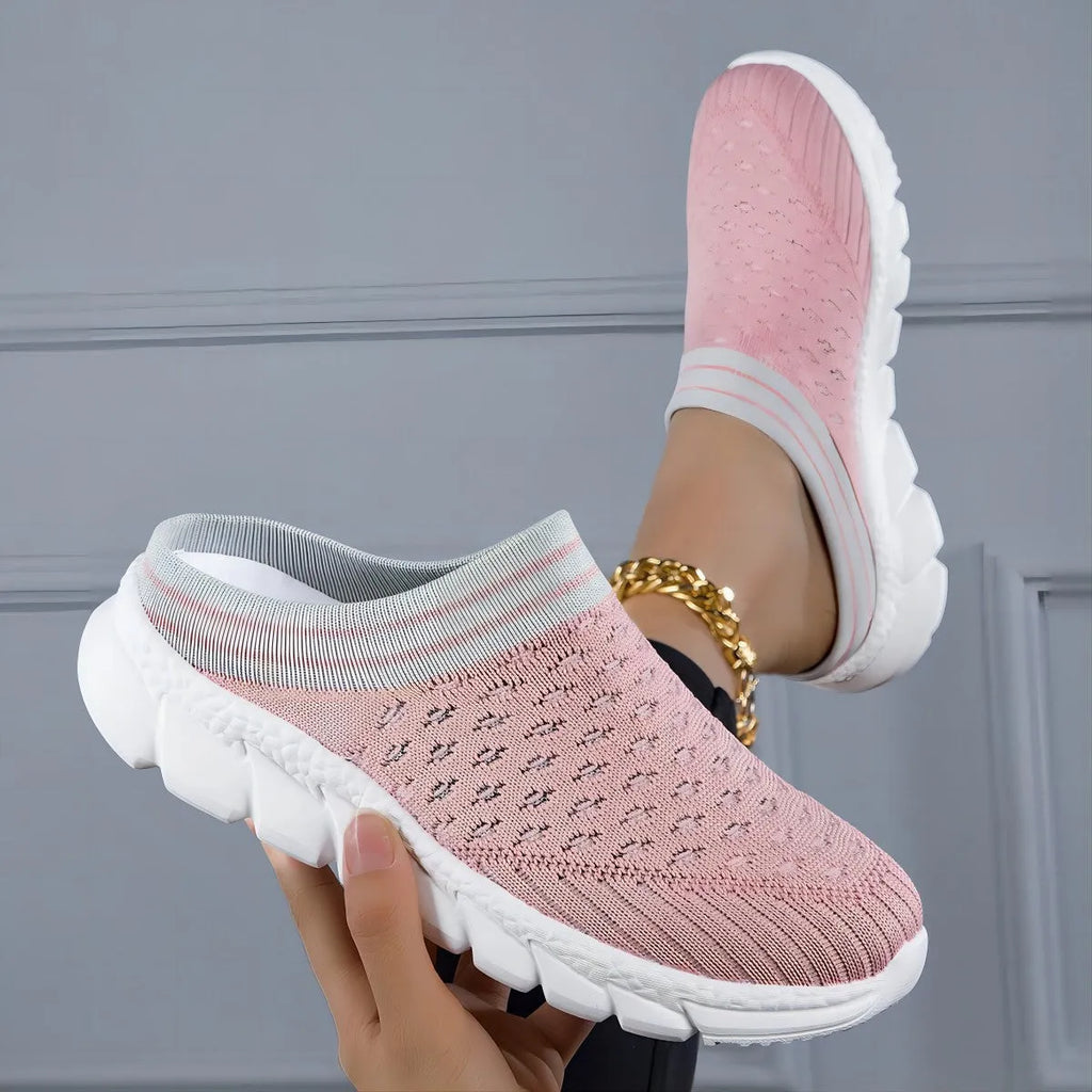 Black, pink, and purple striped Flyknit women's sports slippers with hollowed-out design on a viscose sole.