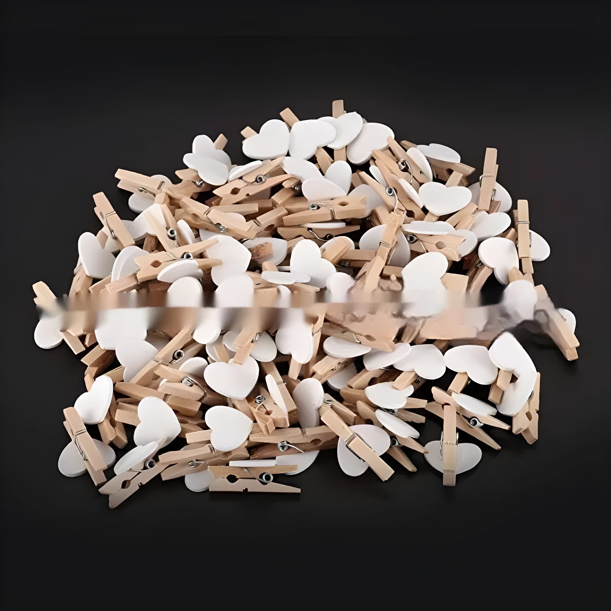 Set of five handmade solid wood heart-shaped clips in red, white, and rose red on a wooden surface.