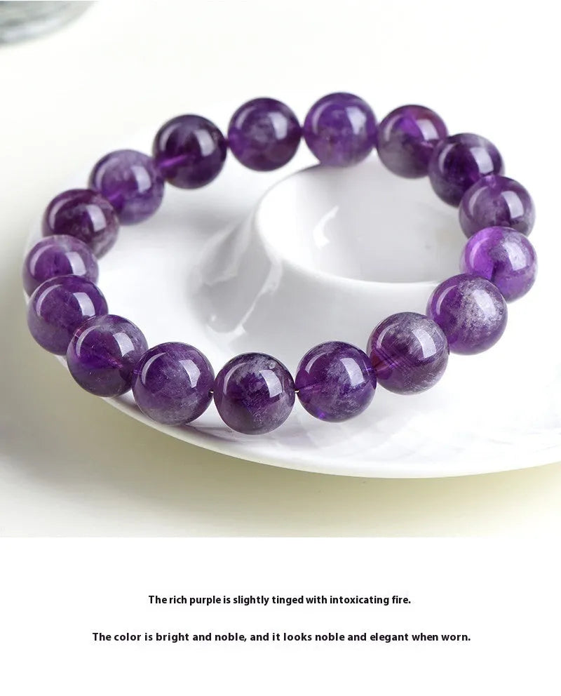 Natural purple Snow Mountain feather amethyst crystal bracelet with scattered geometry beads and Ruyi element.