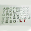 3D metal zinc alloy car bumper sticker showing a raised English letter on adhesive backing.