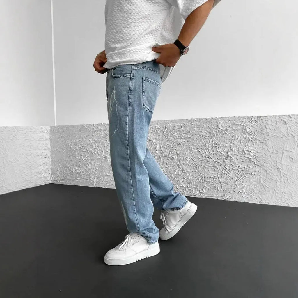 Blue men's straight-leg denim jeans with a loose wide-leg fit and mid-rise waist.