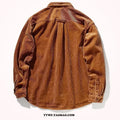 A man's loose-fit corduroy long sleeve casual shirt in caramel colour on a hanger.