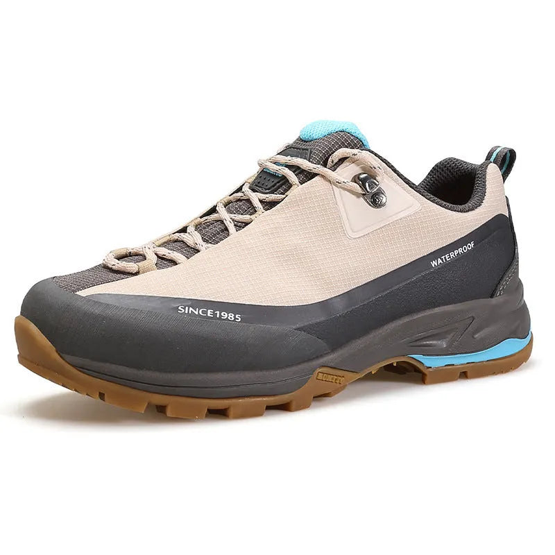 Men's low-top mountain climbing shoes in black with non-slip rubber soles and lace-up front closure