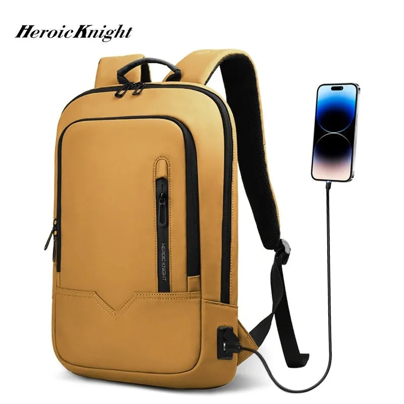 Lightweight orange polyester commuter backpack with USB charging port on the shoulder strap.