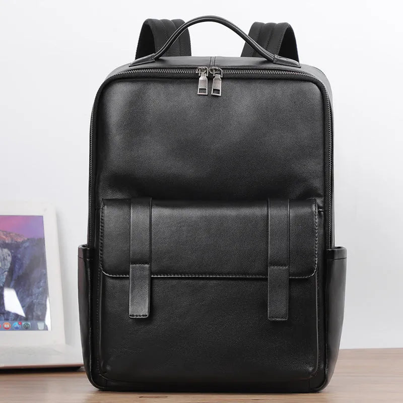 Men's black leather computer backpack with woven detailing and substantial 36-55 litre capacity