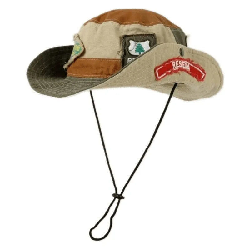 Army green cotton fisherman hat with patchwork design and flat top crown, shown folded for storage