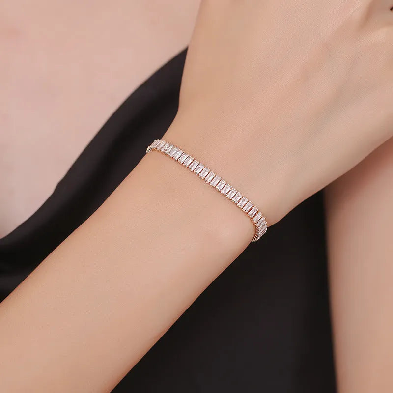Rectangular geometric women's bracelet with full diamond zircon treatment in champagne gold colour