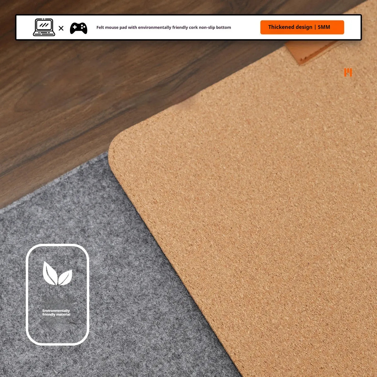 Simple grey felt and cork desk mat in an oversized rectangle shape on a wooden desk.