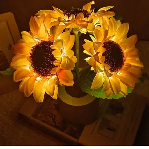 Rechargeable sunflower simulation LED night light table lamp with artificial flowers on a wooden table