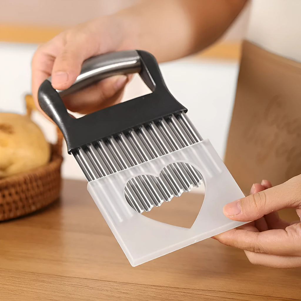 Stainless steel potato wave knife kitchen tool on a wooden surface.