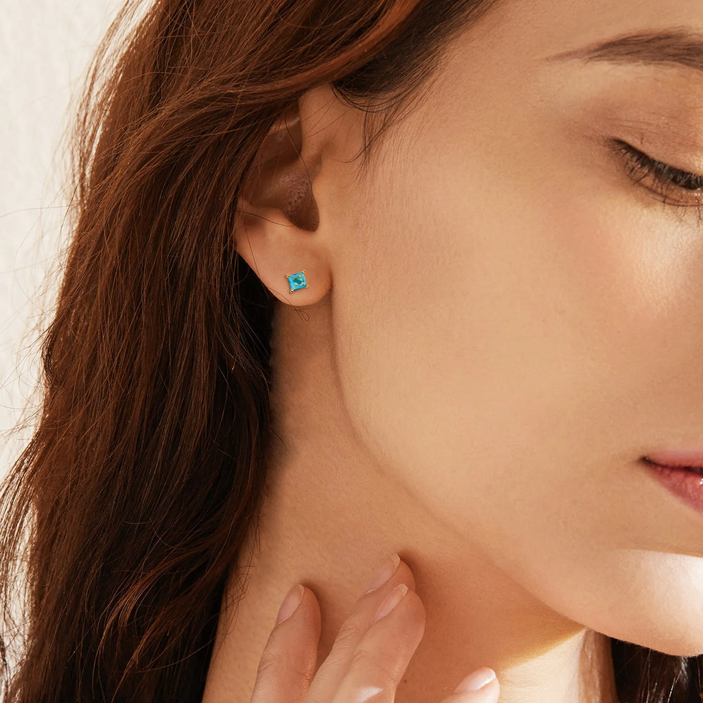 Gold-plated drop earrings with a candy-coloured pear-shaped cubic zirconia stone.