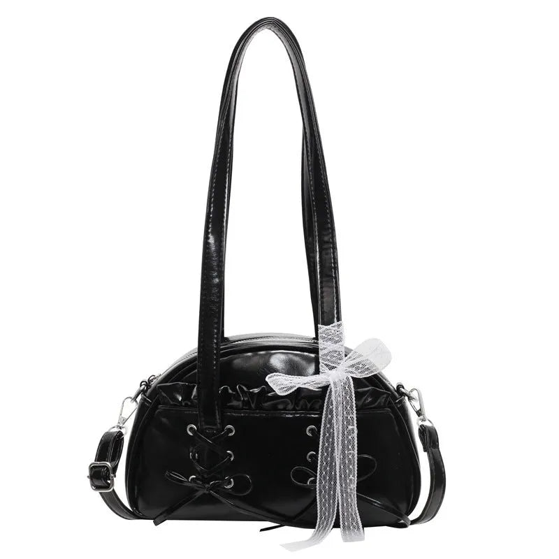 Women's casual shoulder bag in PU leather with a white bandage bow design on the front.