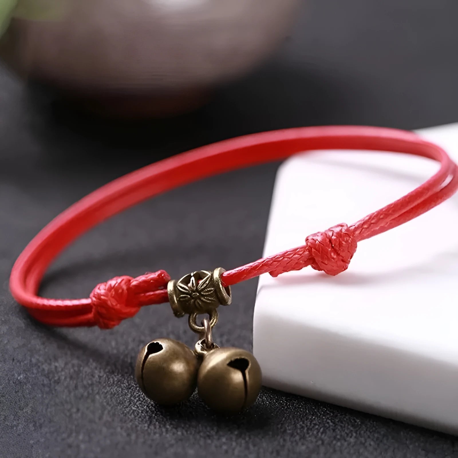 Adjustable nylon dog collar with brass bell in black, red, and coffee colours.