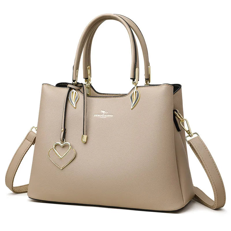 Black women's multi-layer shoulder messenger bag made from PU leather with sewing thread detail.