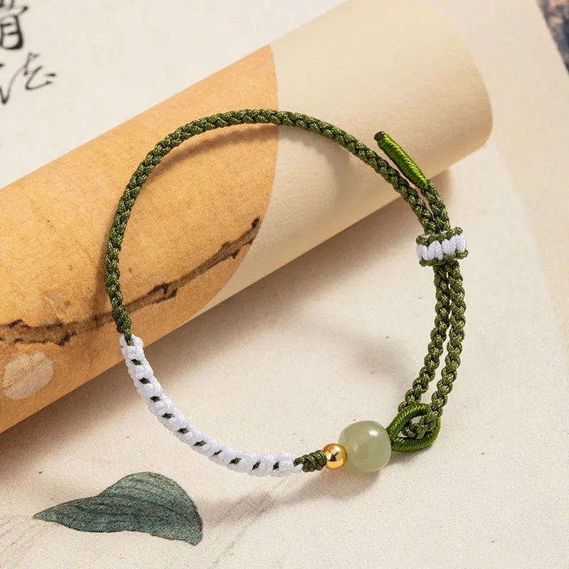 Chinese national bracelet with Hetian jade, sterling silver, and colourful cord carrying strap