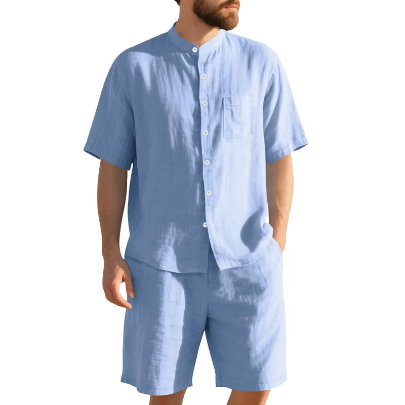 Men's light blue linen blend two-piece suit with short sleeve shirt jacket and shorts on a hanger.