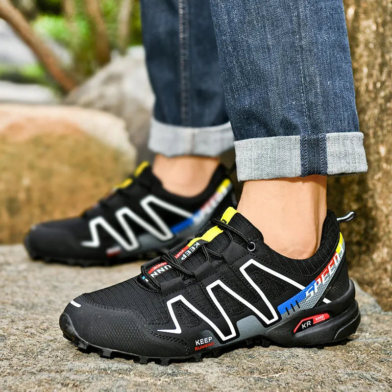 Men's grey orange and black white wide fit casual running shoes with low top design.
