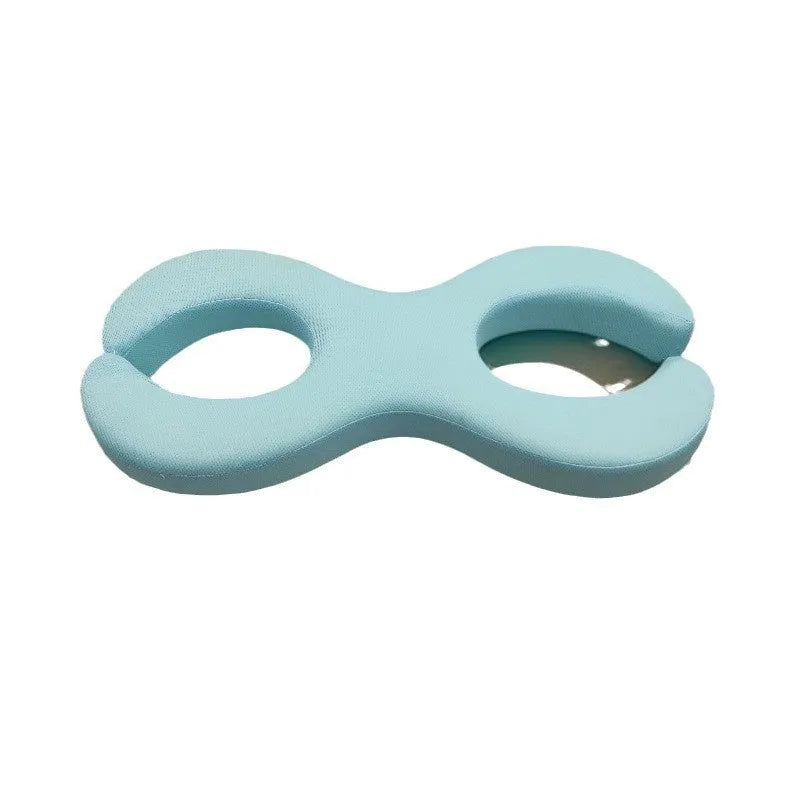 Blue cylindrical memory foam cervical pillow for neck support and spinal alignment.