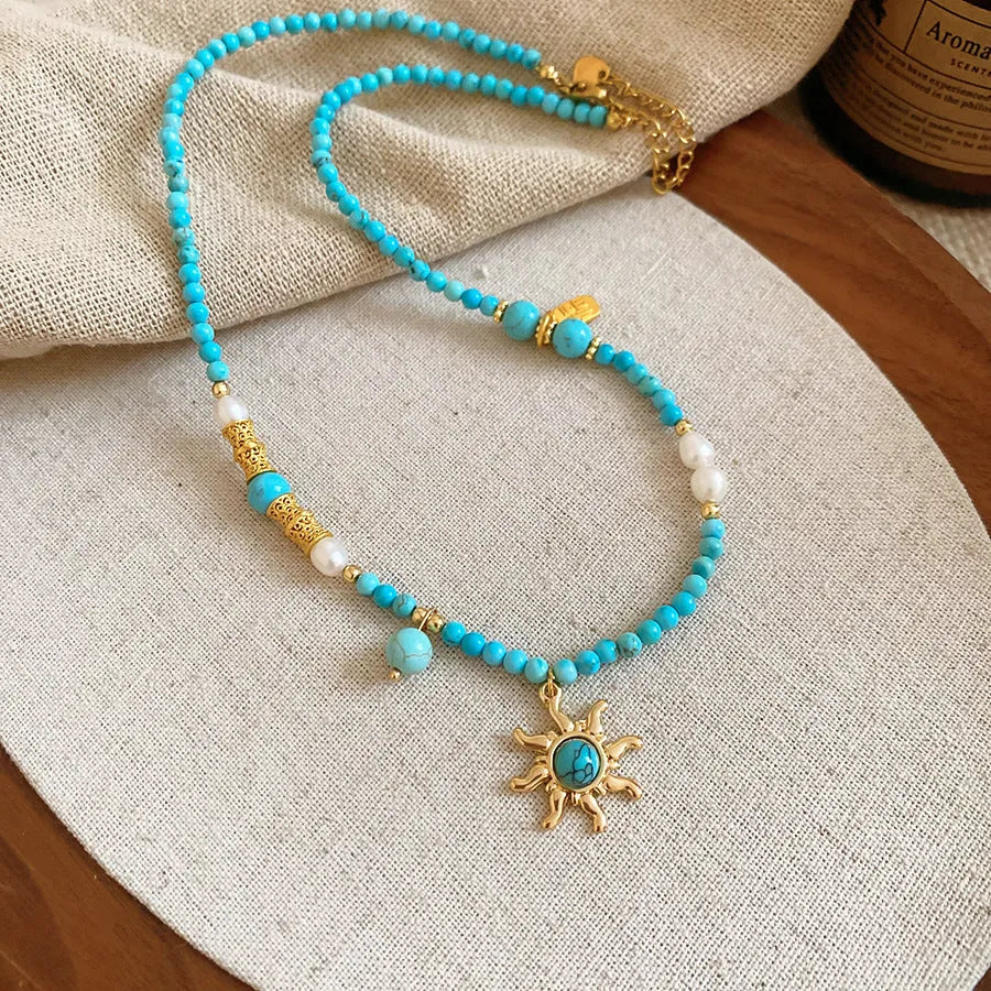 Freshwater pearl necklace with stone pendant and sun charm in geometric French royal court style