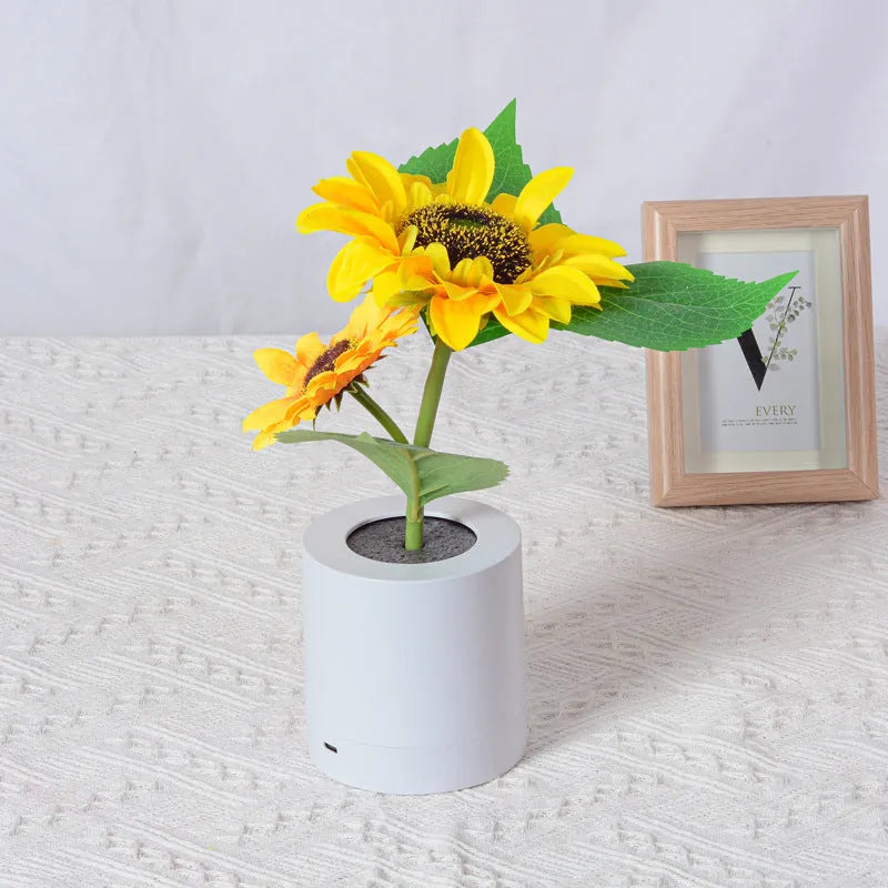 Rechargeable sunflower simulation LED night light table lamp with artificial flowers on a wooden table
