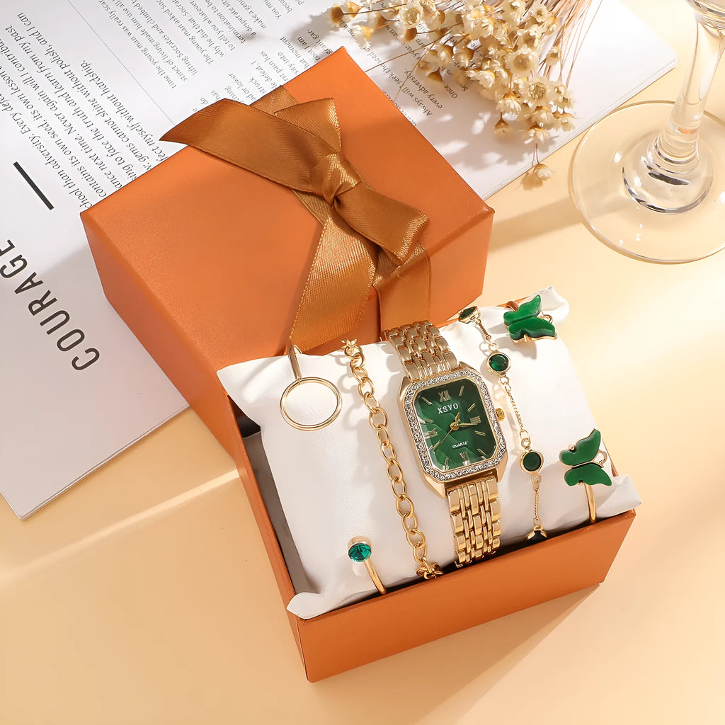 Gold green square steel ladies watch and four matching butterfly jewellery bracelets laid out as a set.