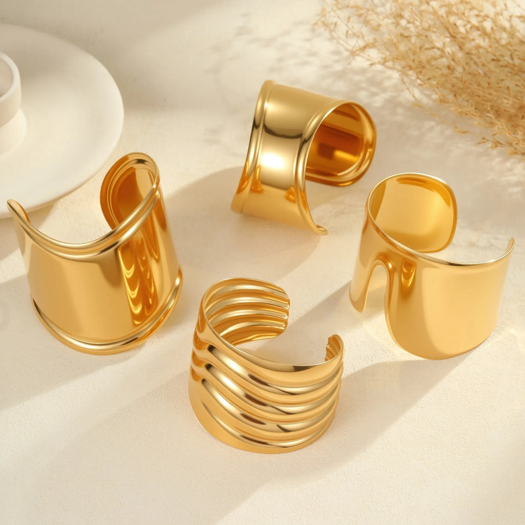 Women's wide wave design bracelet with geometric openings and gold plating finish