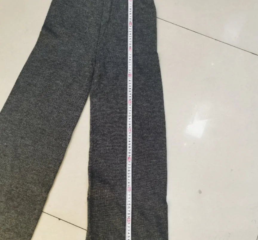 Women's acrylic fabric suit with side-slit sweater and matching trousers in solid colours