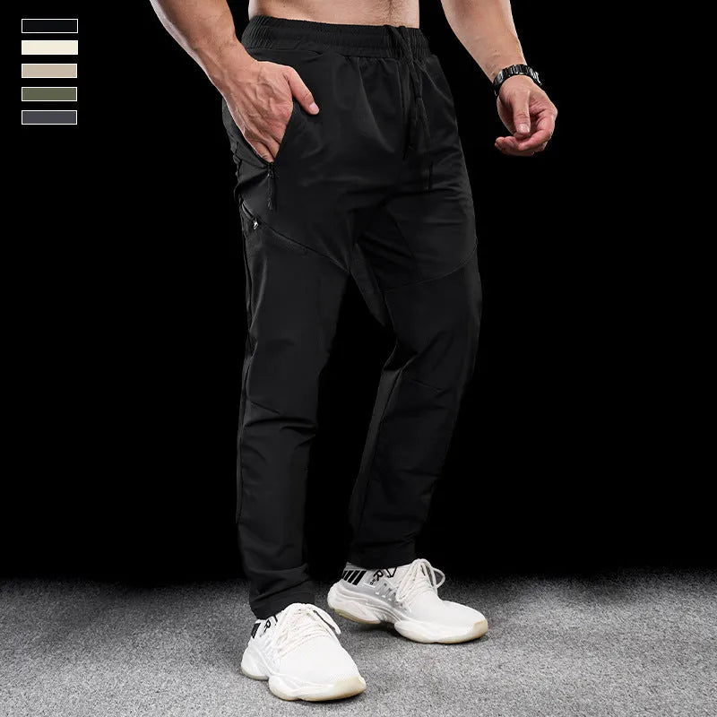Men's black waterproof quick-drying workout pants with mid waist design for sports and fitness