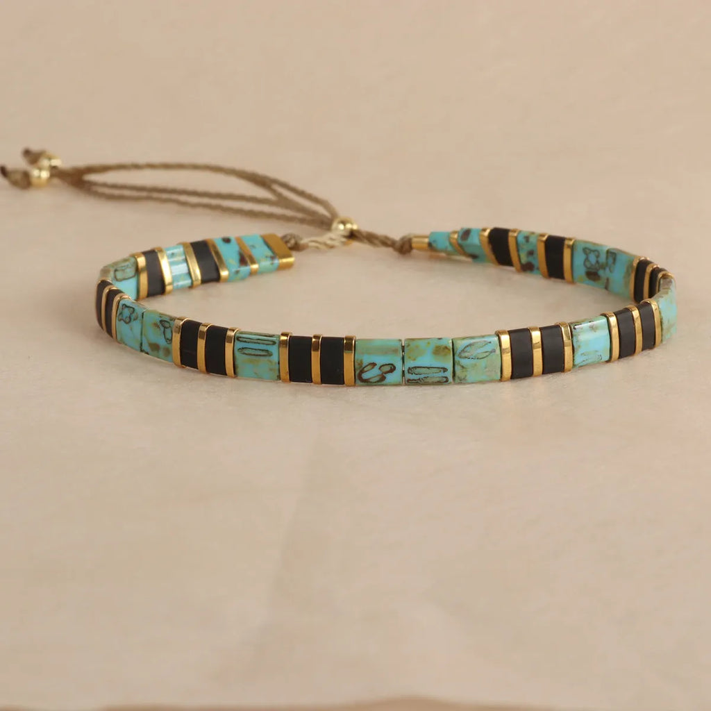 Adjustable glass beaded bracelet in geometric design with round beads available in five colours