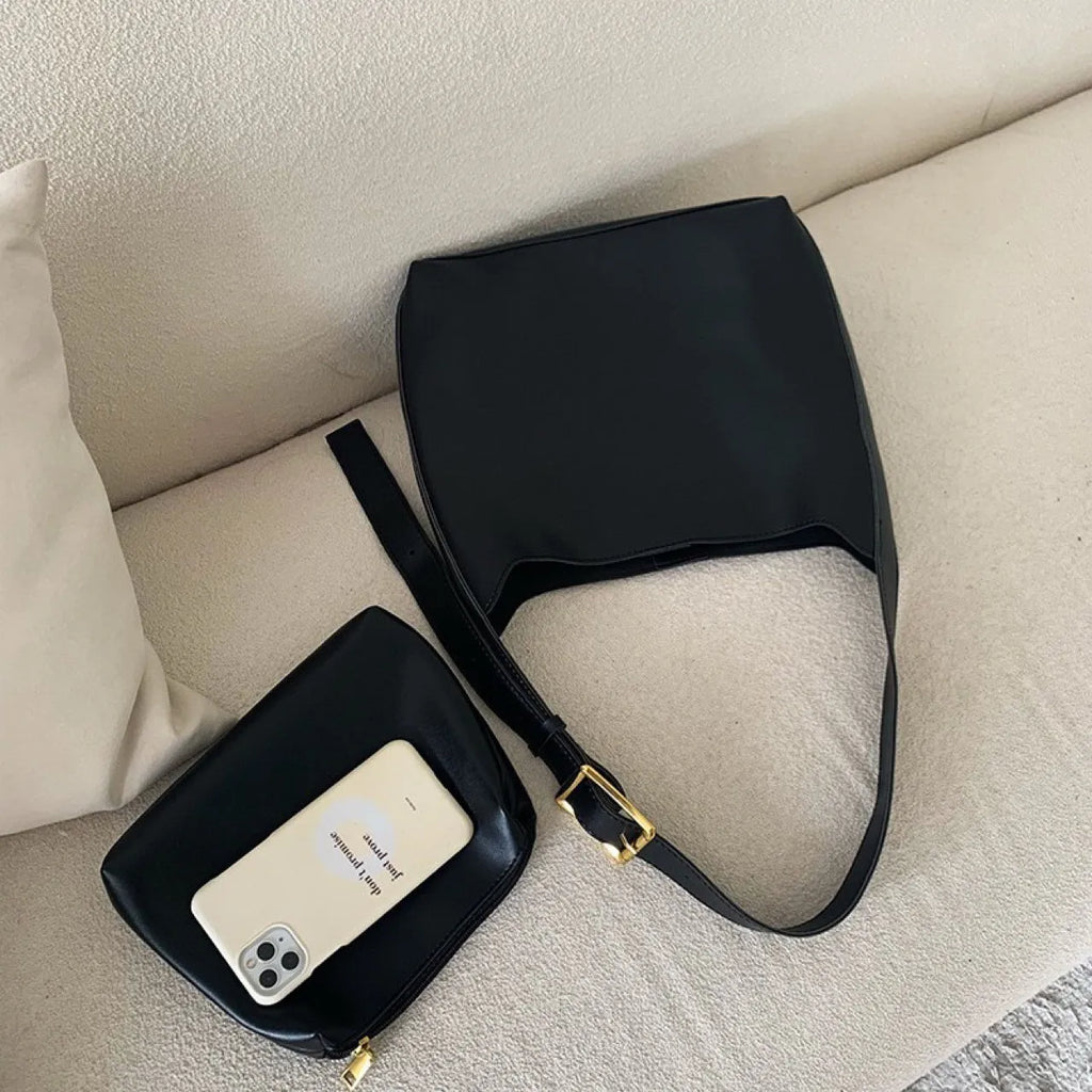 Two women's fashion shoulder bags in black and brown PU leather with swing thread details
