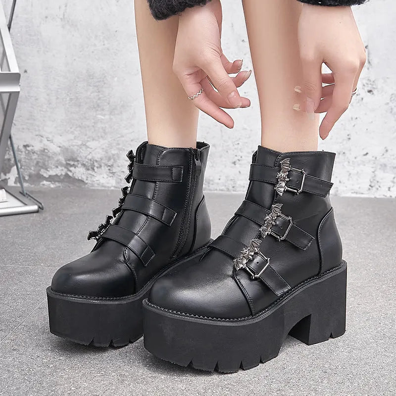 Black women's Harajuku punk ankle boots with bat buckle, thick heel, and side zip.