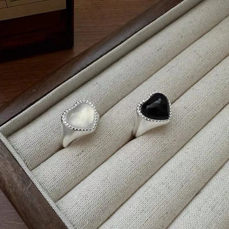 Adjustable sterling silver ring with heart-shaped black agate centrepiece showing open mouth design