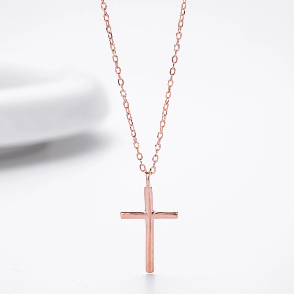 S925 sterling silver necklace with a simple glossy cross pendant on an adjustable O-shaped chain.