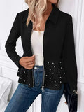 Women's black loose fit coat with heavy-duty zipper and beaded ruffled hem detail