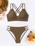 Women's black halter V-neck bikini top and matching split-style swim shorts.