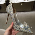 Women's gold high heels with pointed toe, rhinestone decoration, and stiletto heel